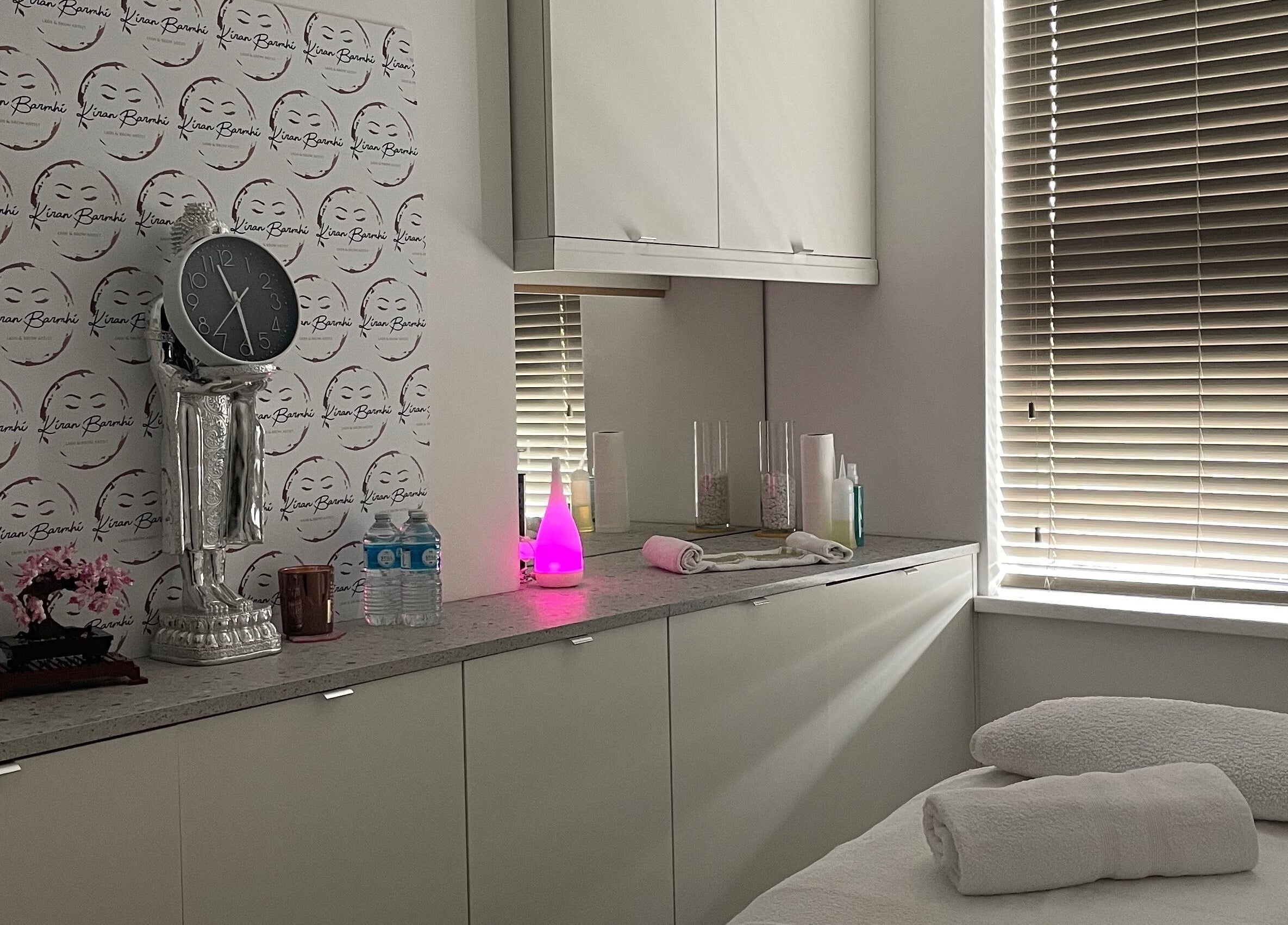 Cozy treatment room at Kiran Barmhi Beauty and Massage Therapist, Birmingham, England, GB, with soft lighting.