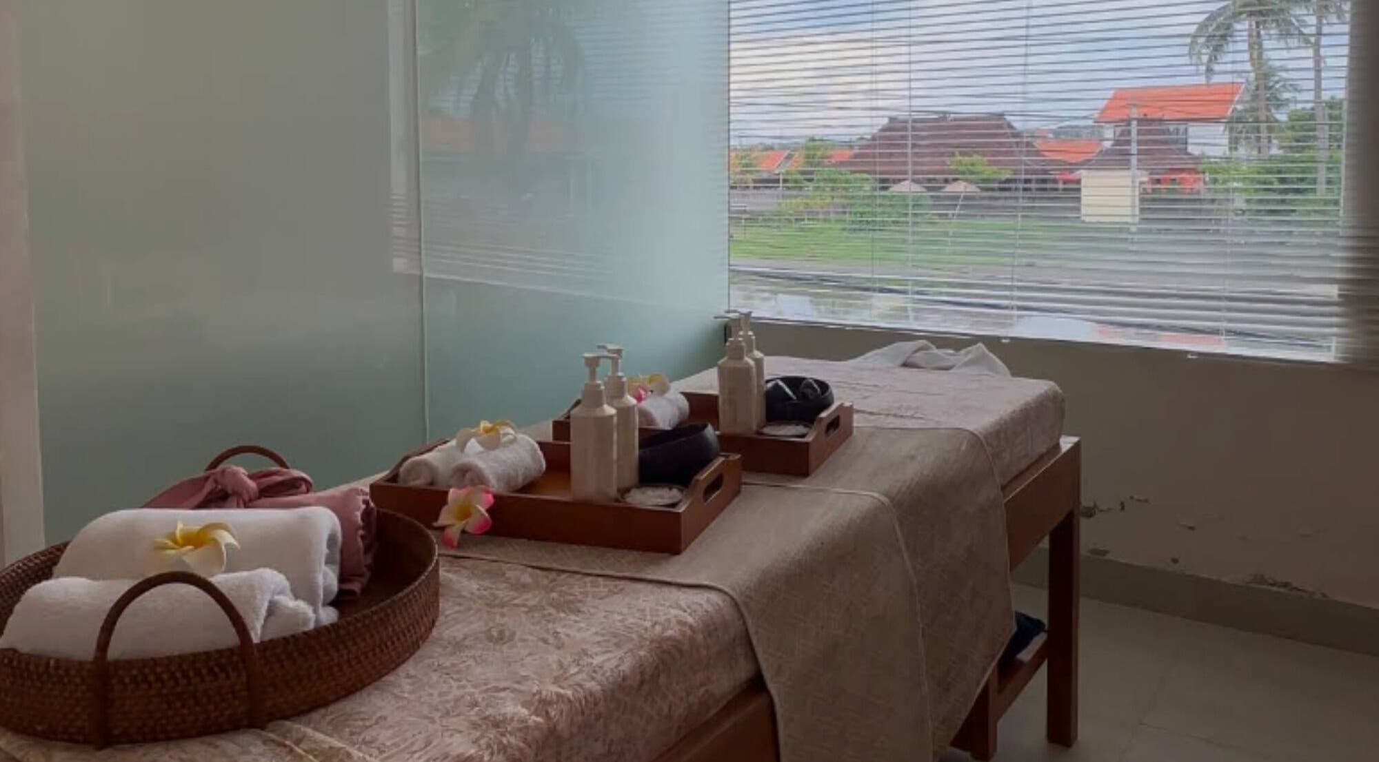 Tranquil massage room at Asera Nail & Spa in Bali, Bali, ID with cozy spa beds and a view.