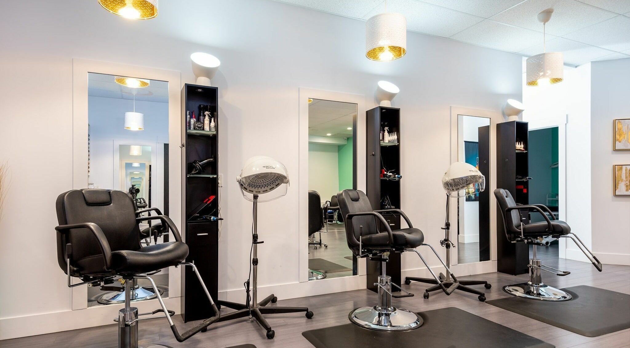 Sleek styling stations at Le Salon Dieppe, Dieppe, New Brunswick, CA, showcasing modern salon chairs and equipment.