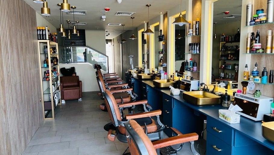 Modern barber chairs and styling stations at Tajriba Mithaliya Men Personal Care, Ajman, Ajman, AE.