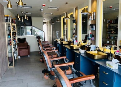 Modern barber chairs and styling stations at Tajriba Mithaliya Men Personal Care, Ajman, Ajman, AE.
