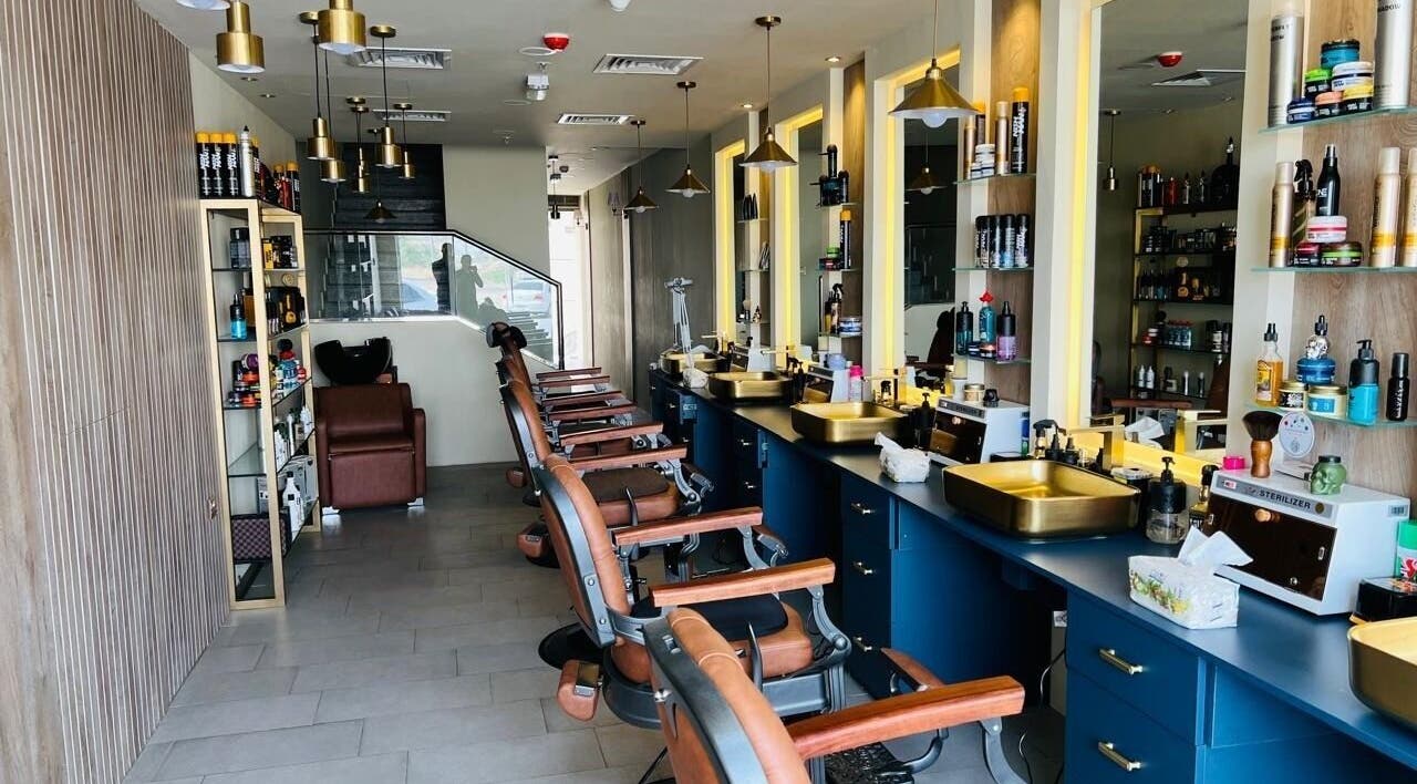 Modern barber chairs and styling stations at Tajriba Mithaliya Men Personal Care, Ajman, Ajman, AE.
