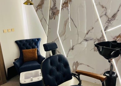 Elegant barber chair and wash station at Tajriba Mithaliya Men Personal Care, Ajman, Ajman, AE.