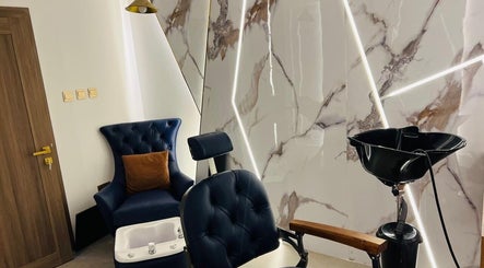 Elegant barber chair and wash station at Tajriba Mithaliya Men Personal Care, Ajman, Ajman, AE.