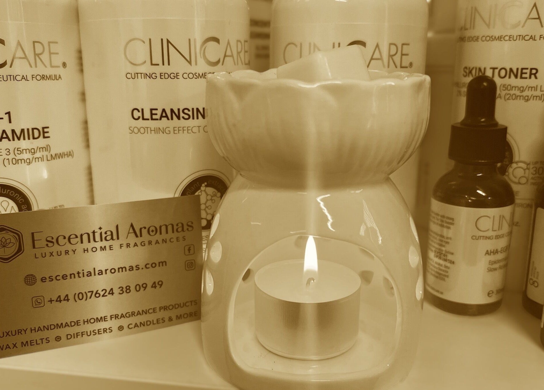 Fresh Faces in Port Erin displays skincare products and a candle, enhancing wellness ambiance.