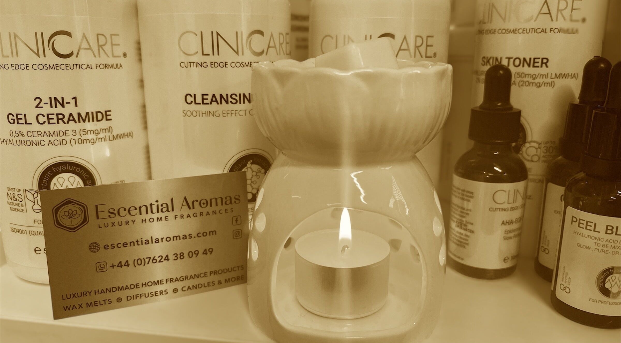 Fresh Faces in Port Erin displays skincare products and a candle, enhancing wellness ambiance.