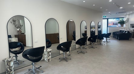 Modern interior of Salon Lio in Crows Nest, NSW, AU, featuring sleek styling stations and chic decor.