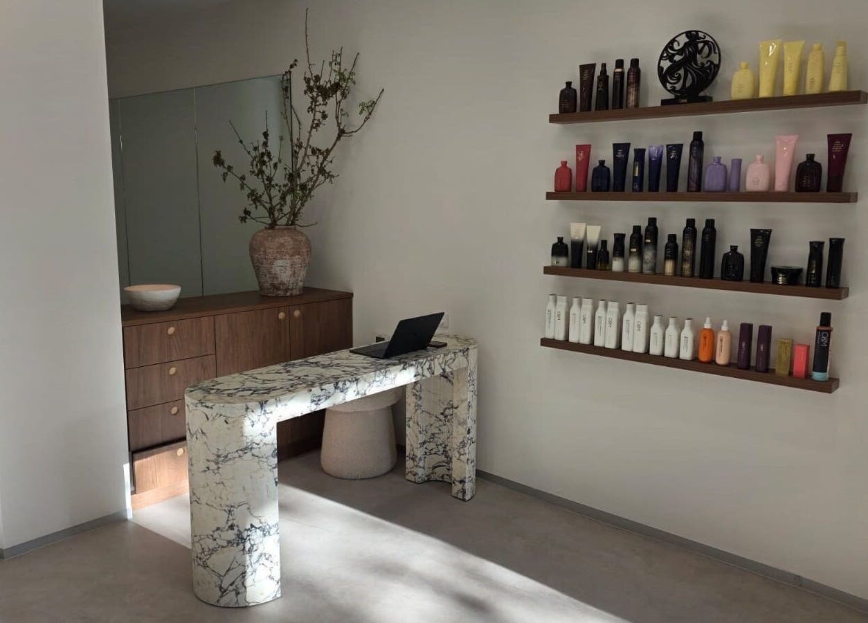 Modern reception at Salon Lio in Crows Nest, New South Wales, AU with sleek shelves of beauty products.