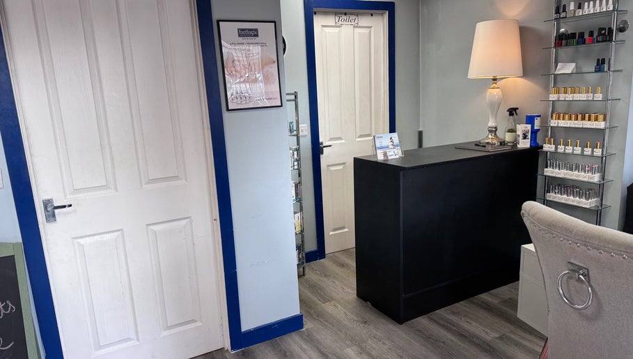 Reception area of K G Beauty - Located within Enliven, Edinburgh, Scotland, GB. Features elegant decor and nail polish display.