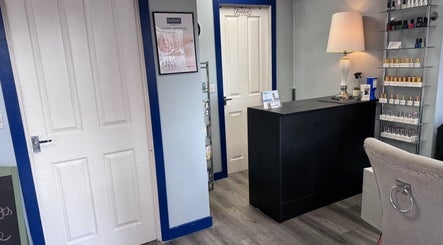 Reception area of K G Beauty - Located within Enliven, Edinburgh, Scotland, GB. Features elegant decor and nail polish display.