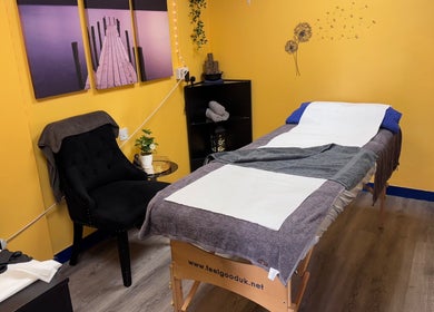 A cozy treatment room at K G Beauty - Located within Enliven, Edinburgh, Scotland, GB featuring a massage table.