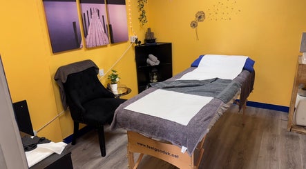 A cozy treatment room at K G Beauty - Located within Enliven, Edinburgh, Scotland, GB featuring a massage table.