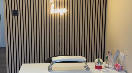 Modern beauty desk with neon sign at K G Beauty, Edinburgh, Scotland, GB.