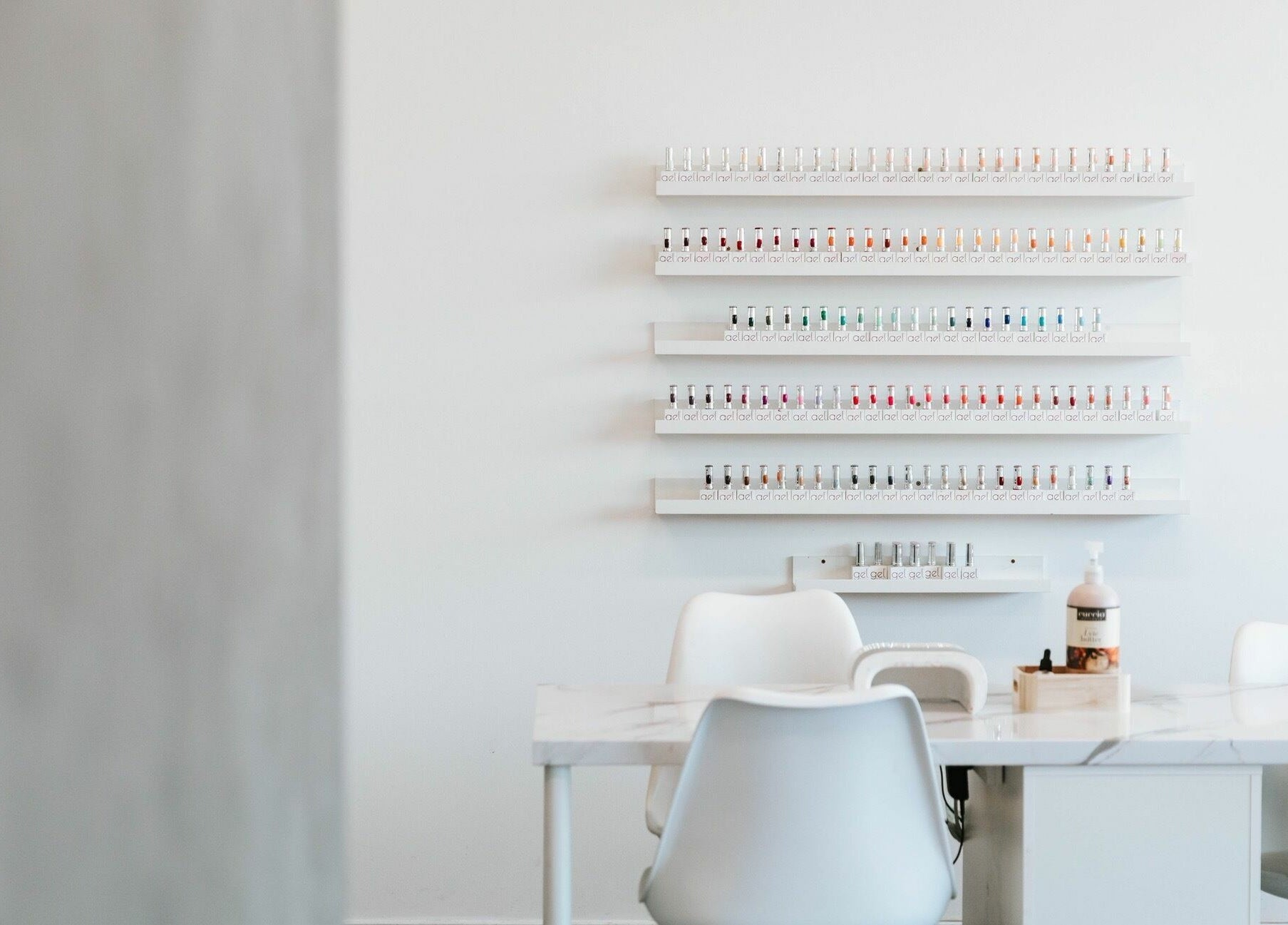 BEAUTICO salon interior showing nail polish rack and manicure station in Melbourne, Victoria, AU.