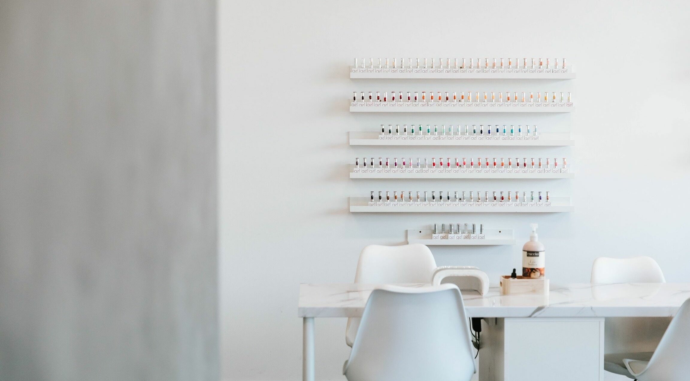 BEAUTICO salon interior showing nail polish rack and manicure station in Melbourne, Victoria, AU.
