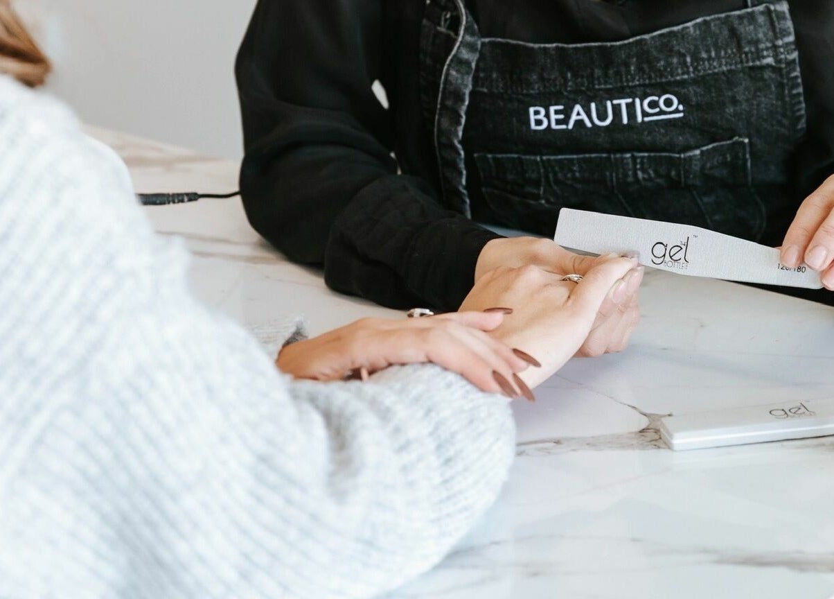 BEAUTICO. nail care session in Melbourne, Victoria, AU. Close-up of hands during manicure.