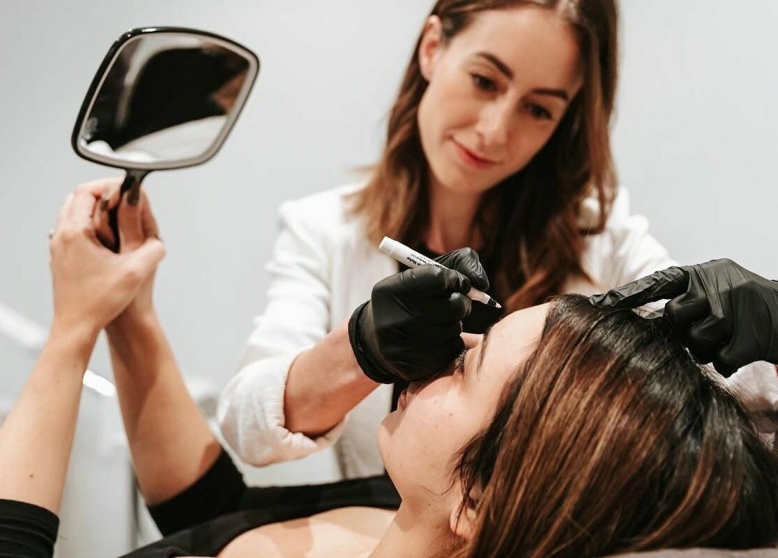 Expert beautician performing eyebrow treatment at BEAUTICO, Melbourne, Victoria, AU.