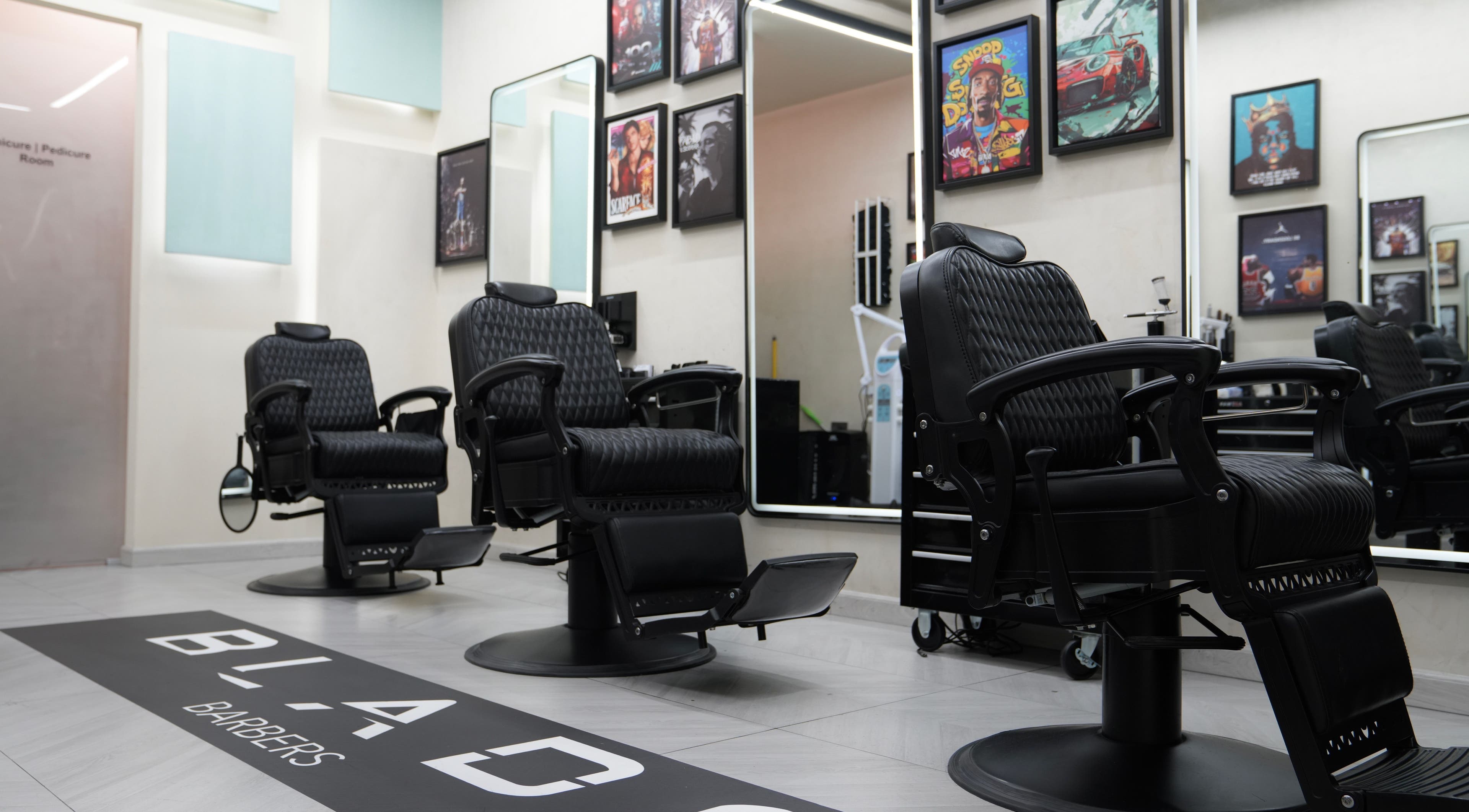 Elegant barber chairs at Blade Barbers Dubai showcasing a modern interior in Dubai, Dubai, AE.