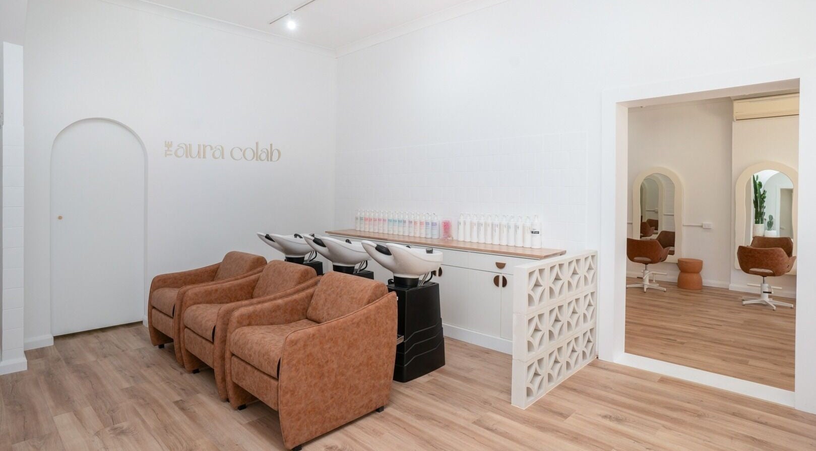 Elegant salon chairs at The Aura Colab, Loftus, New South Wales, AU - inviting atmosphere for beauty treatments.