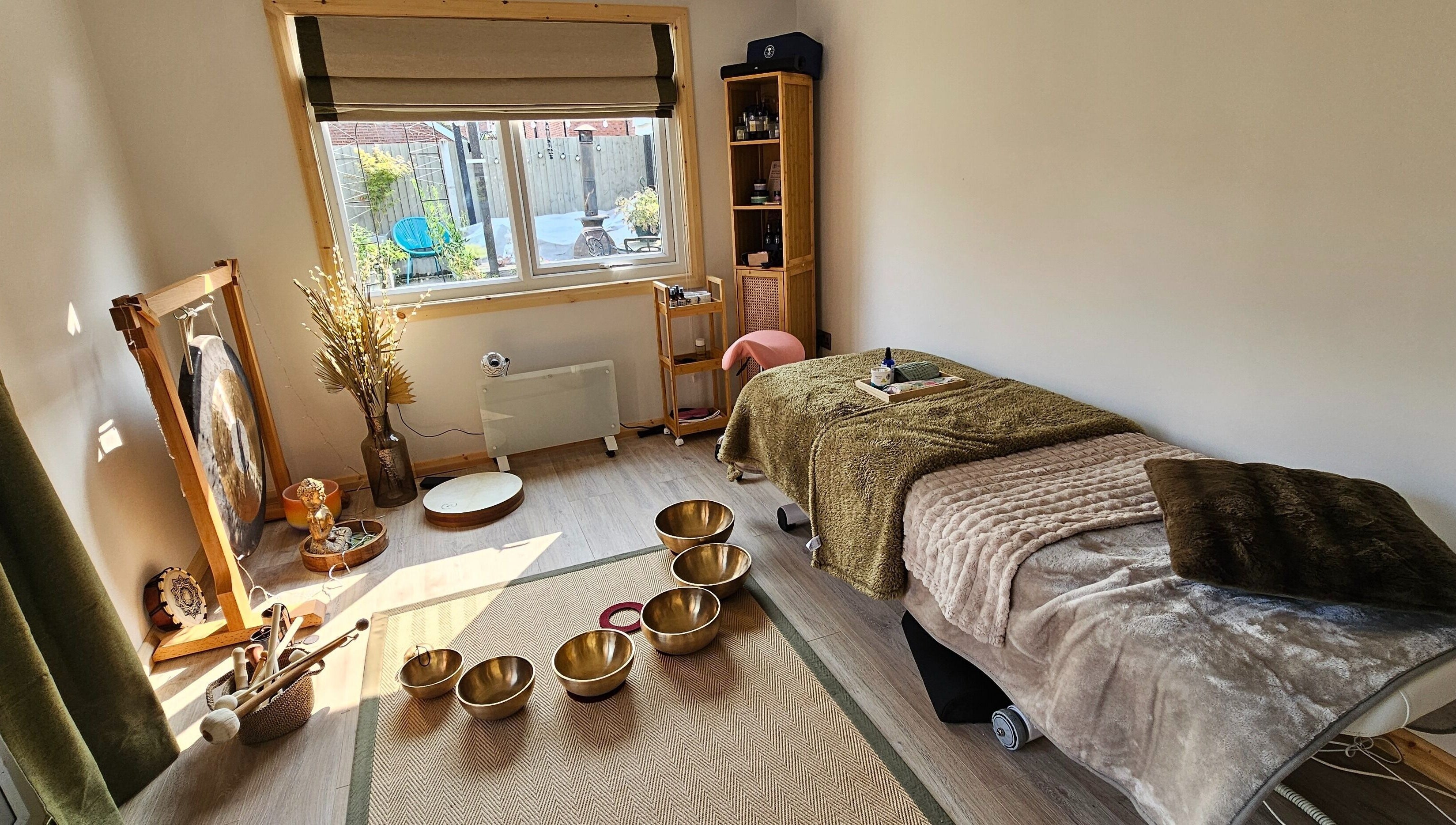Relaxing therapy room at Calm by Nature Reflexology, Bromborough, England, GB with a cozy massage bed.