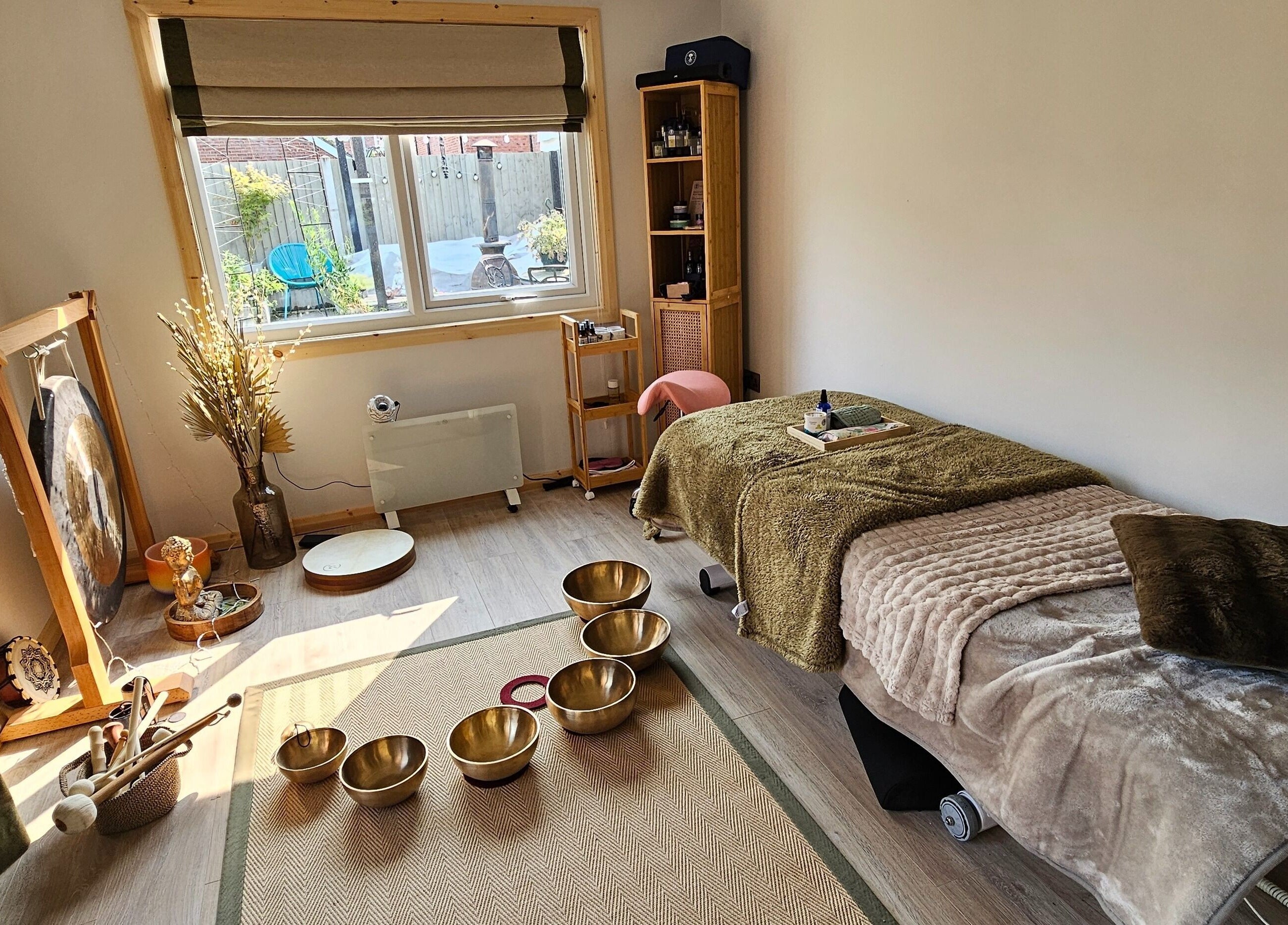 Relaxing therapy room at Calm by Nature Reflexology, Bromborough, England, GB with a cozy massage bed.