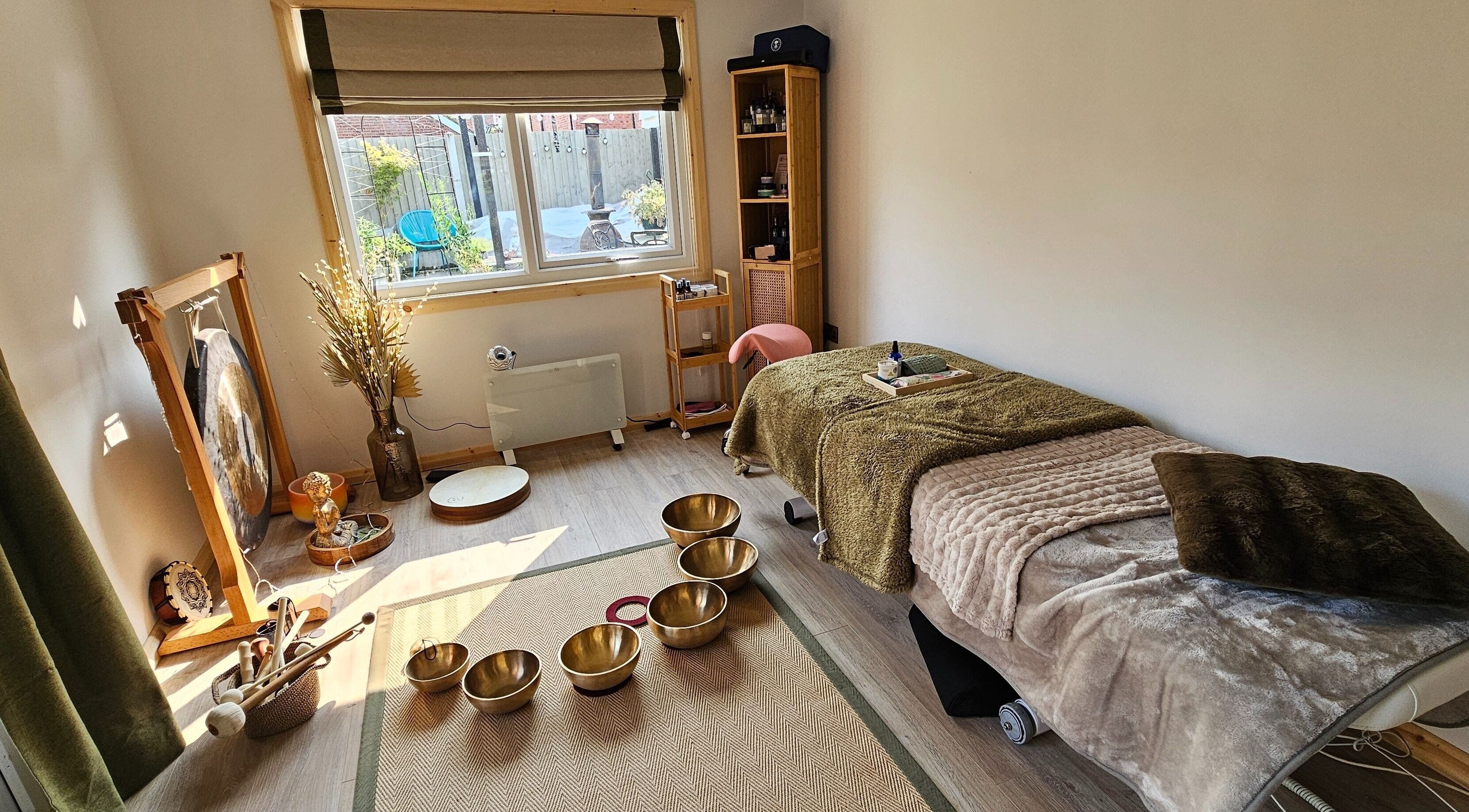 Relaxing therapy room at Calm by Nature Reflexology, Bromborough, England, GB with a cozy massage bed.