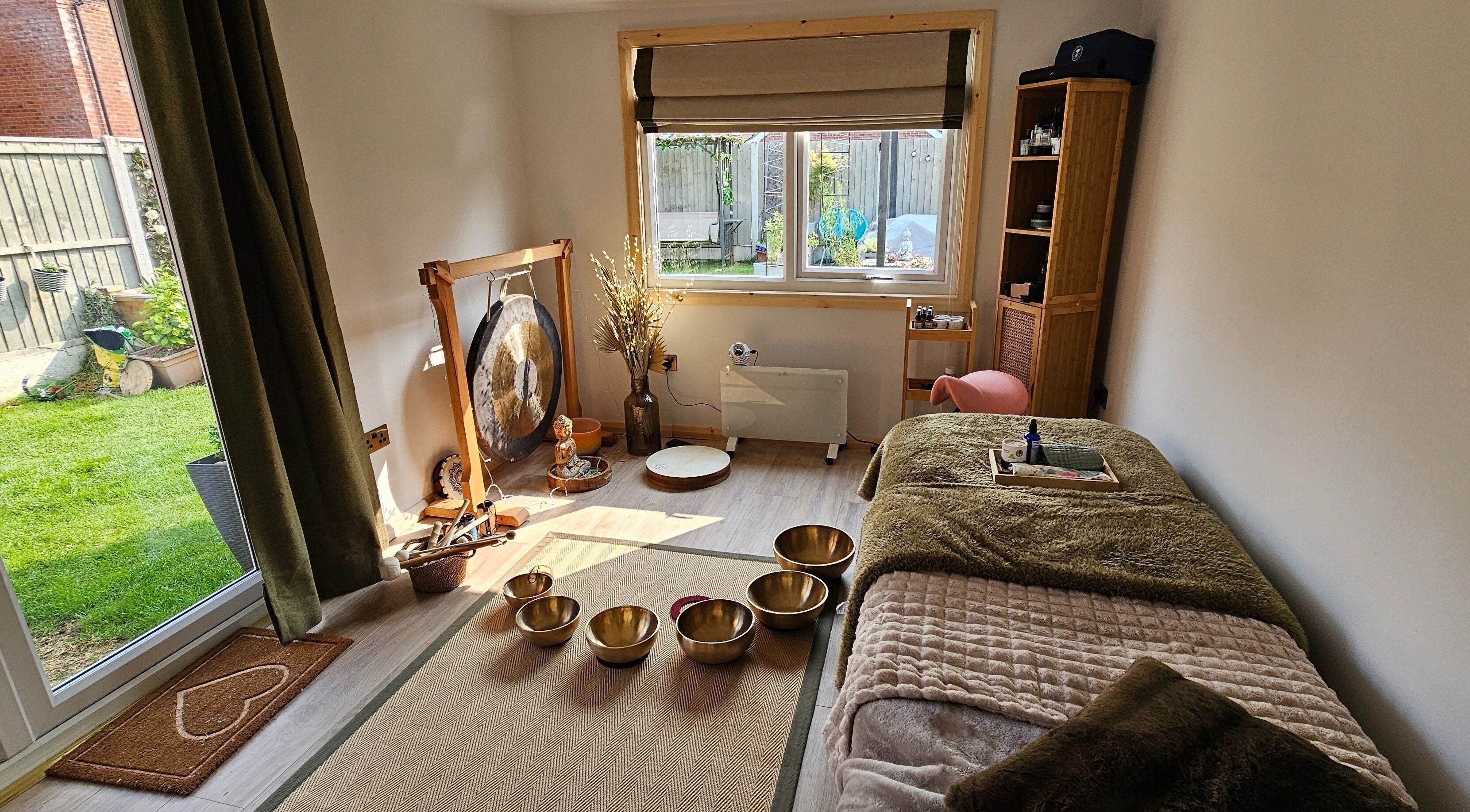 Relaxing therapy room with Tibetan bowls at Calm by Nature Reflexology in Bromborough, England, GB.