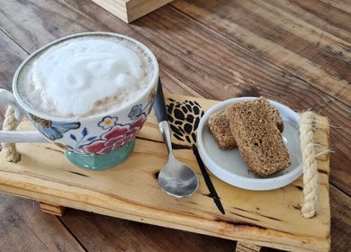 Enjoy a floral cappuccino with rusks at Sam Swartz Hair, Cape Town, Western Cape, ZA.