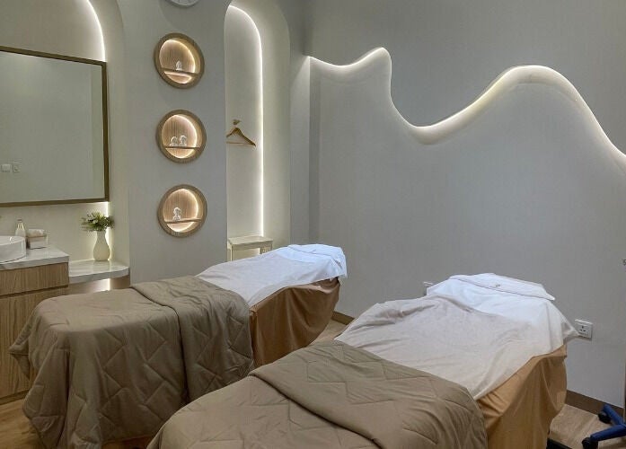 Calm spa room with two massage beds at Skin Central, Batam, Kepulauan Riau, ID.