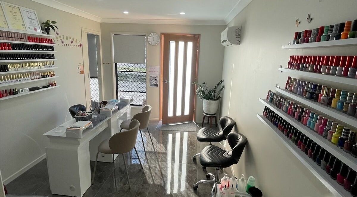 Interior of Southport Nails & Beauty, Southport, Queensland, AU featuring a stylish nail polish display and seating.