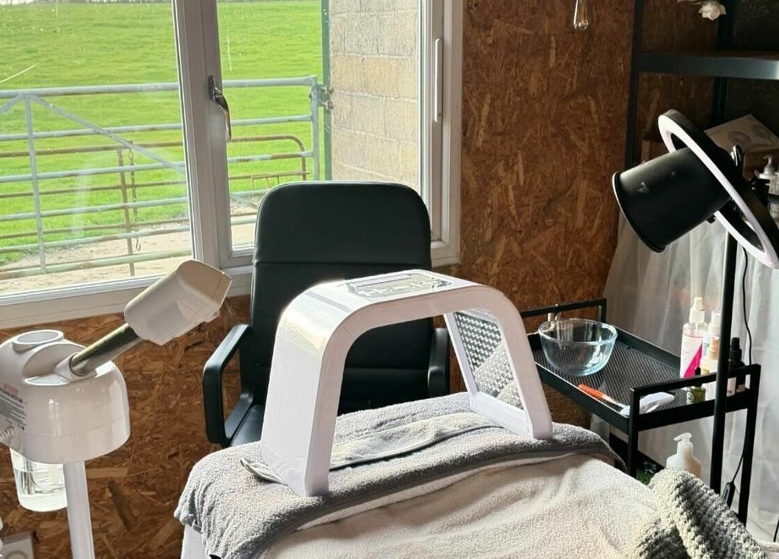 Cozy wellness treatment room at The Mulberry Tree, Radwinter, England, GB with spa equipment and scenic view.