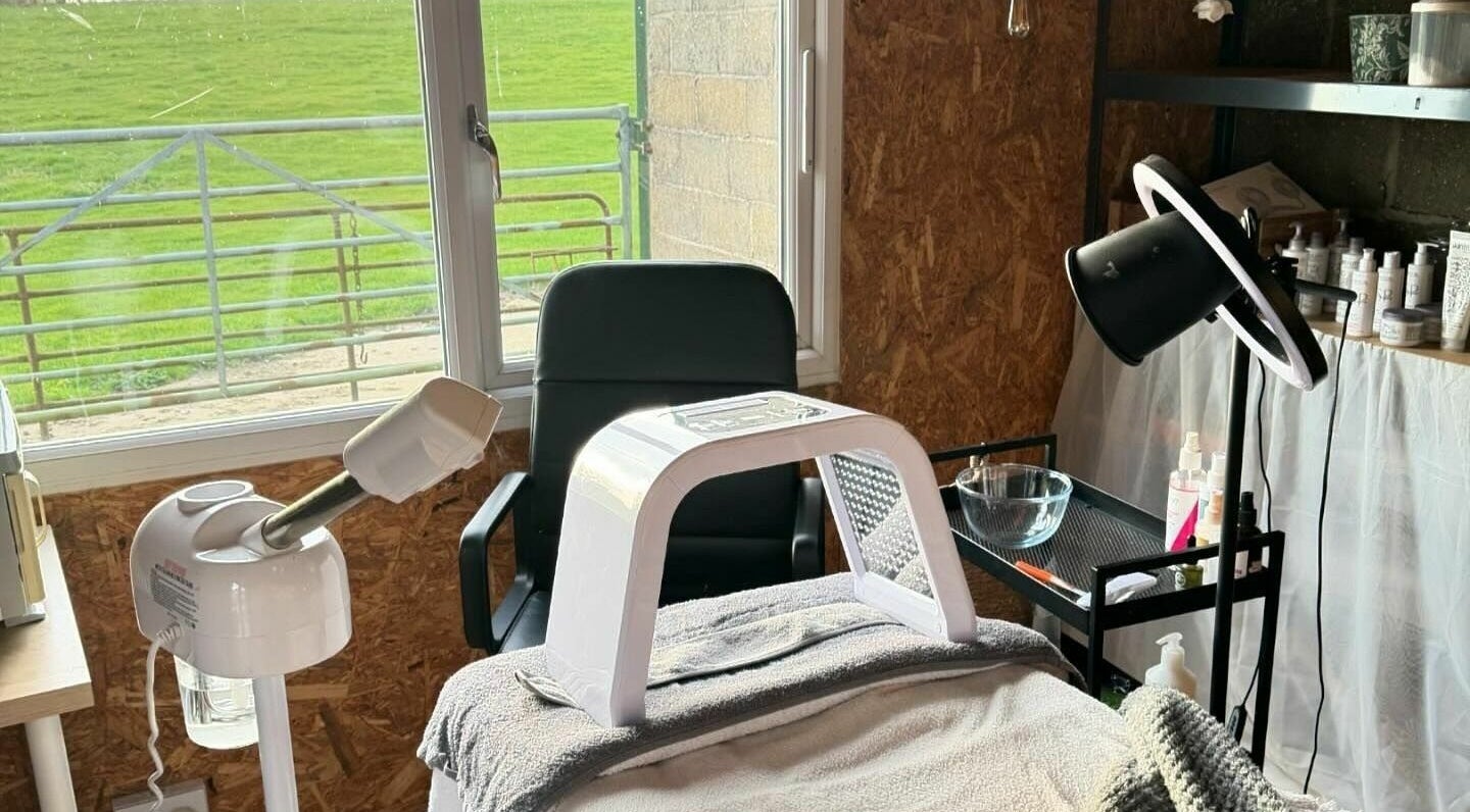 Cozy wellness treatment room at The Mulberry Tree, Radwinter, England, GB with spa equipment and scenic view.