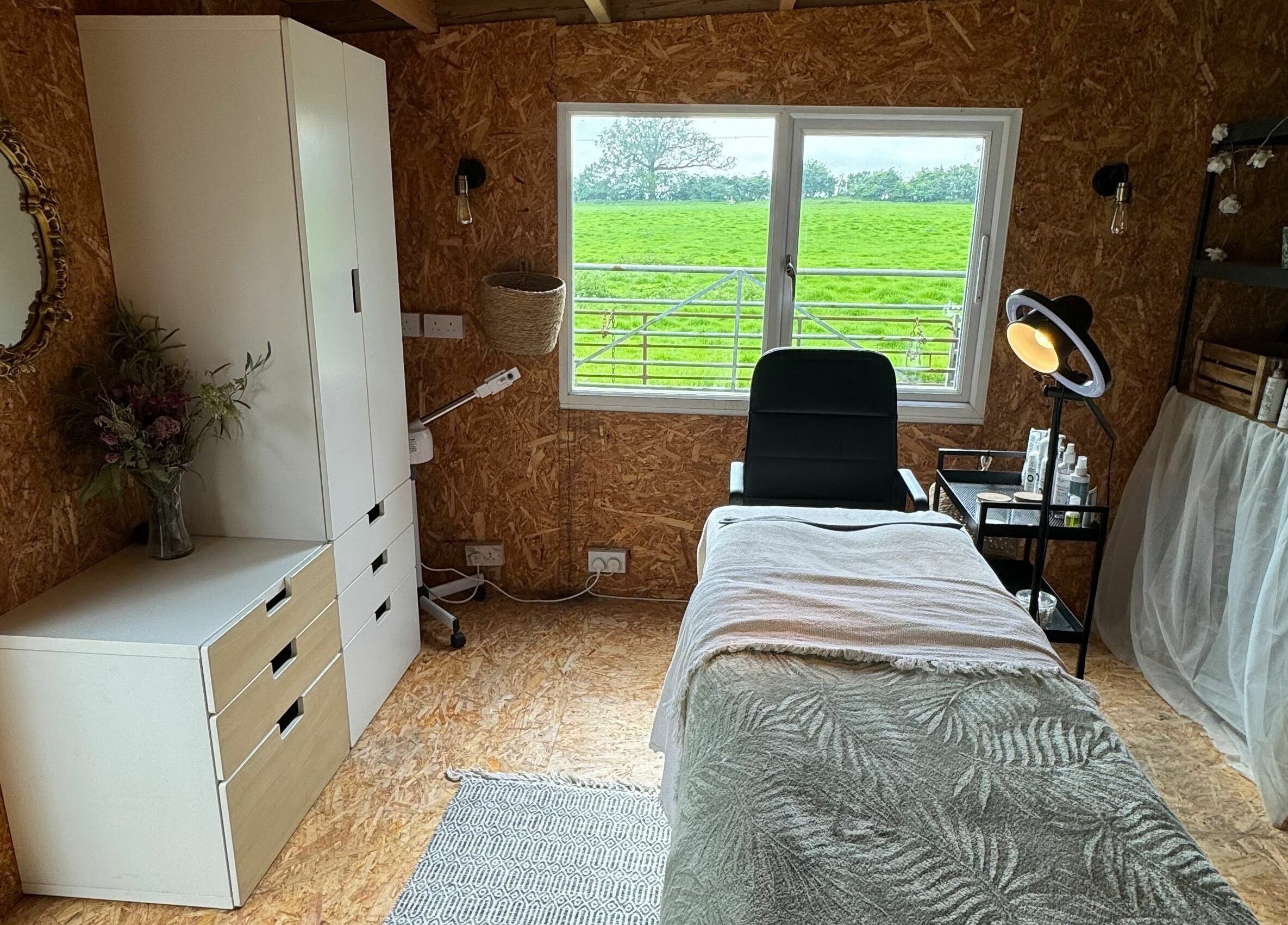 Relaxing treatment room at The Mulberry Tree, Radwinter, England, GB, offering a serene pampering experience.