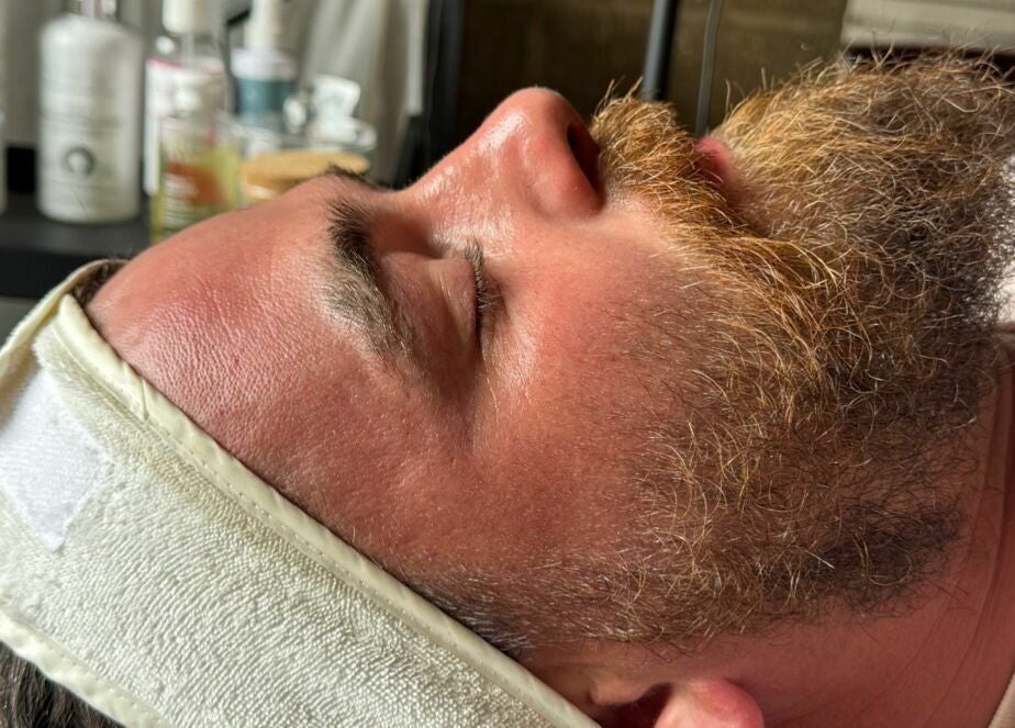 Man enjoys a soothing facial at The Mulberry Tree, Radwinter, England, GB, enhancing wellness and relaxation.