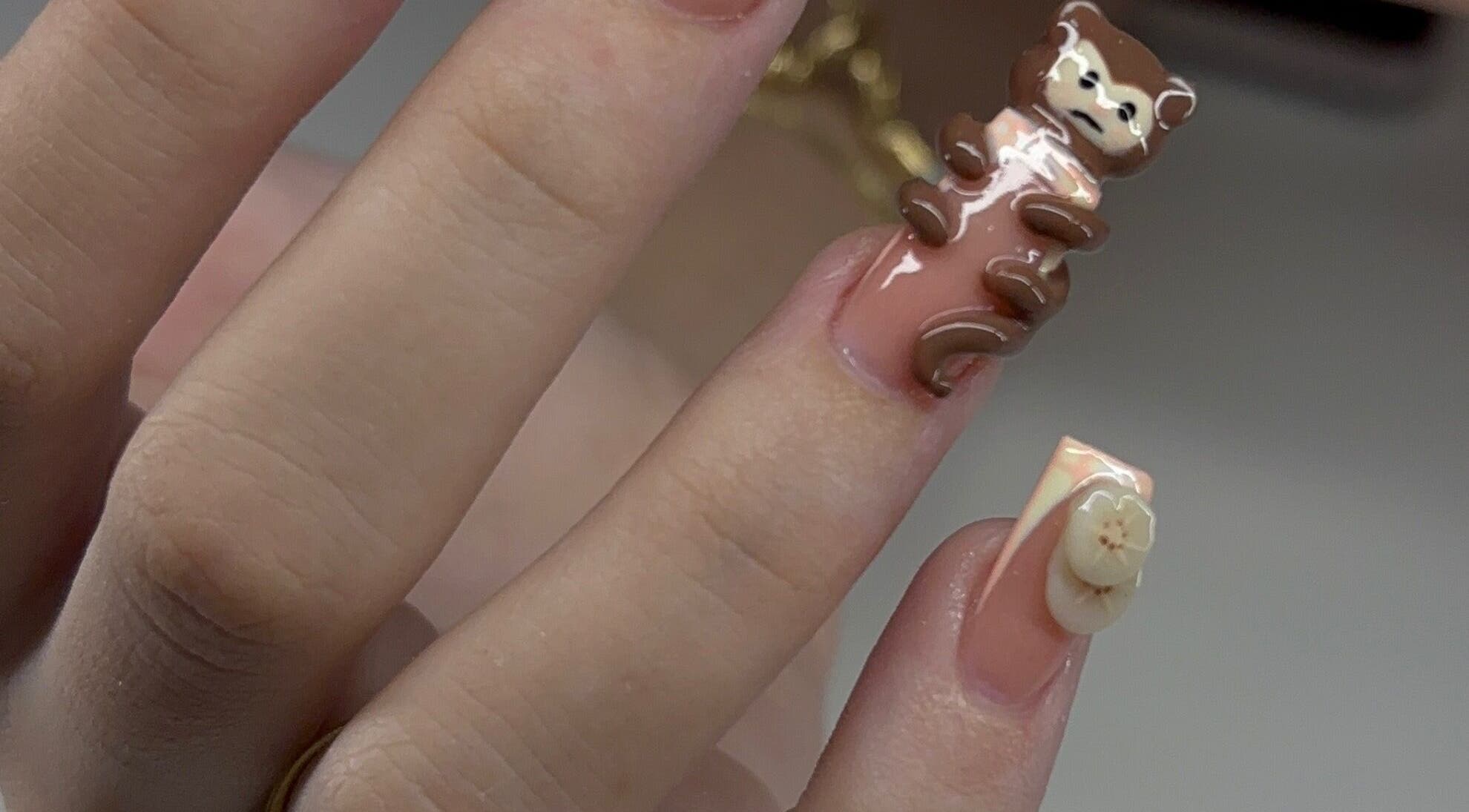 Unique bear nail art at Devine Essence, Willemstad, CW, showcases creative manicure designs.