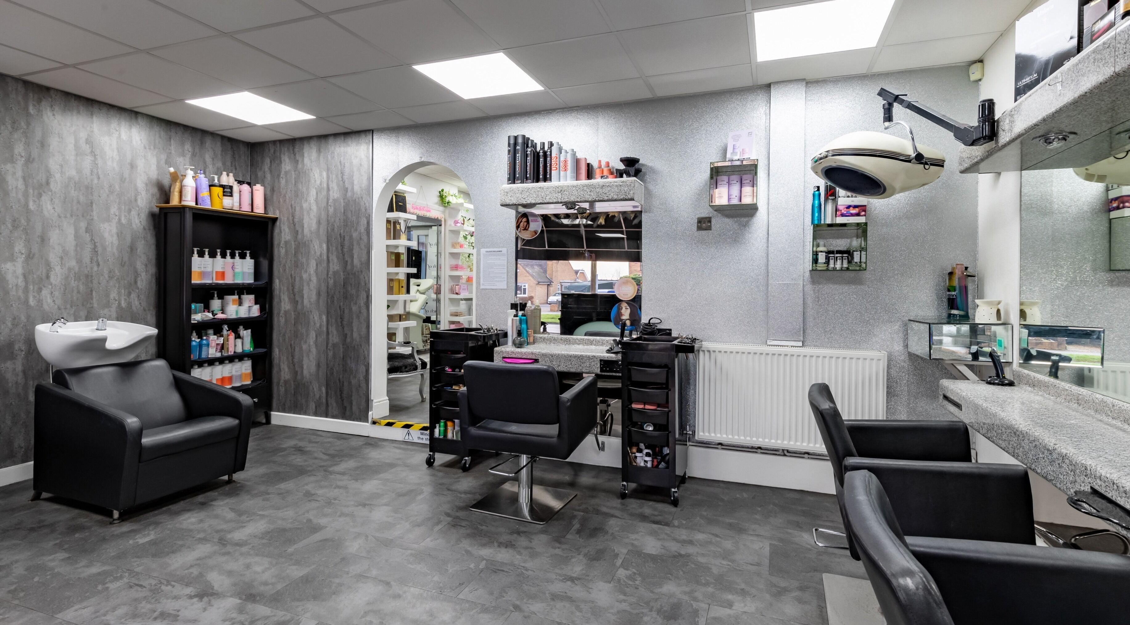 Modern salon at Touch Of Class Hair & Beauty Limited, Halesowen, England, GB with sleek styling stations.