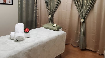 Relaxing massage room at Chaba Thai Massage LLC in Bethesda, MD, US, featuring tranquil decor and plush linens.