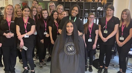 Group of students at Unique Hair Academy Limited, Stoke-on-Trent, England, GB, showcasing their skills.