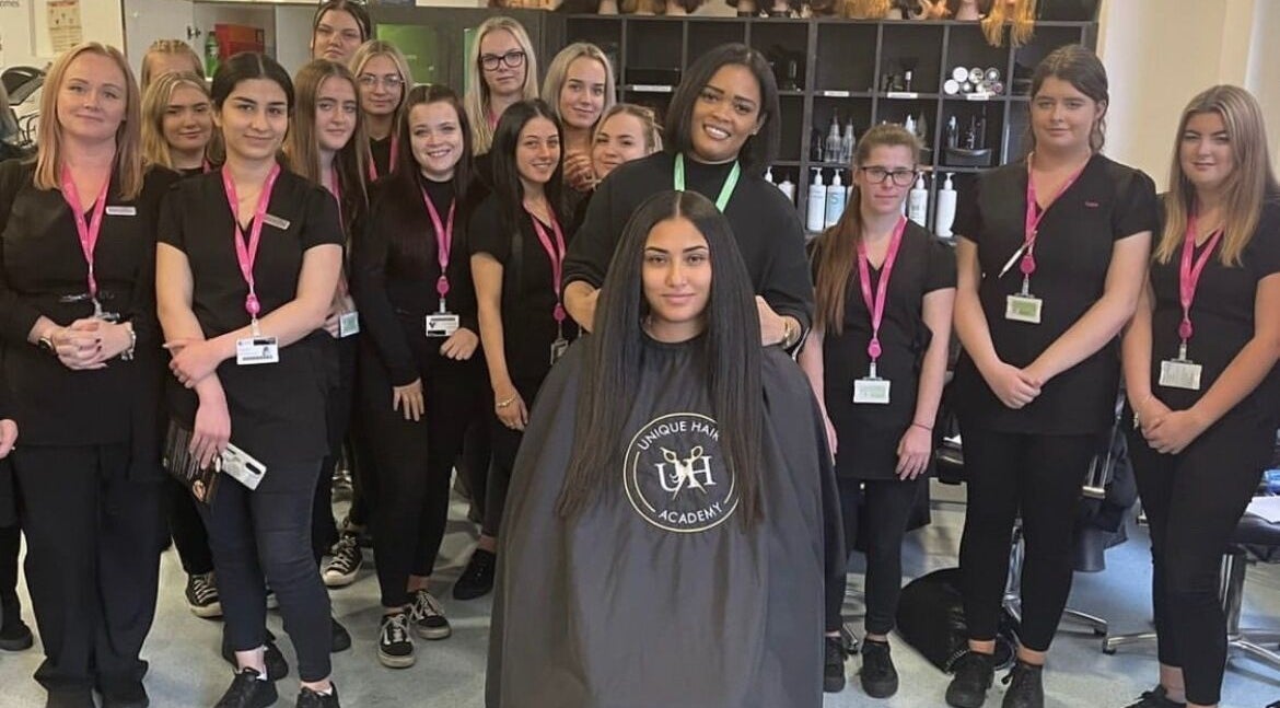 Group of students at Unique Hair Academy Limited, Stoke-on-Trent, England, GB, showcasing their skills.