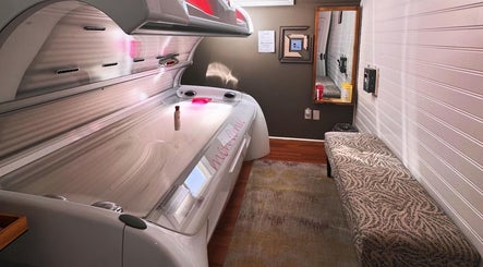 Modern tanning bed at Tan'd by Alena in Mamaroneck, New York, US, enhancing wellness and glowing skin.