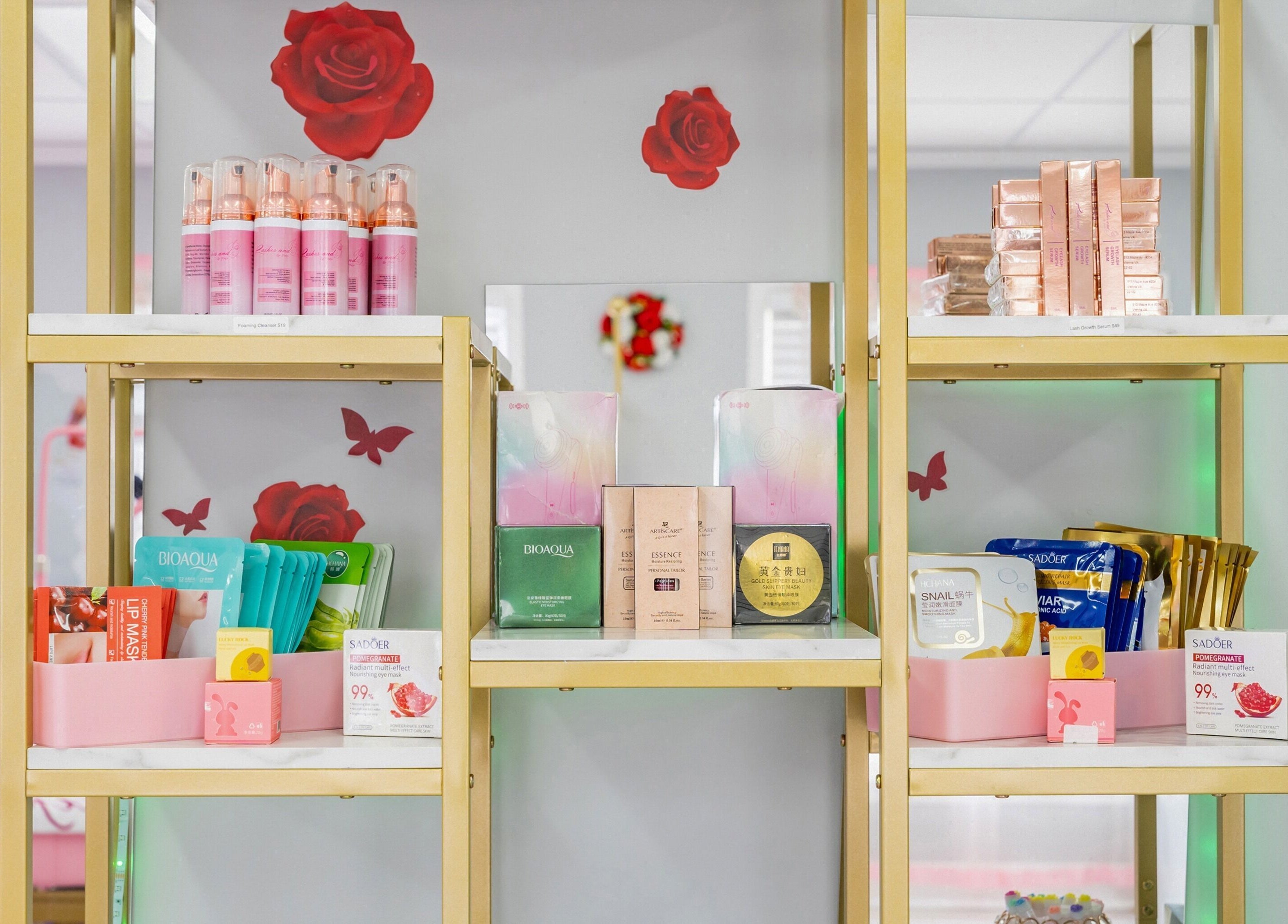 Luxury beauty product display at Lash and Spa ByNeda, Vienna, VA, US, with elegant decor and shelving.