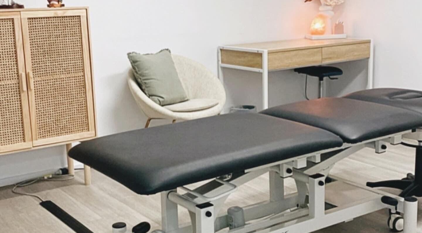 Cozy treatment room at Nxt Level Integrated Health Pty Ltd, Bundall, Queensland, AU, featuring a massage table.
