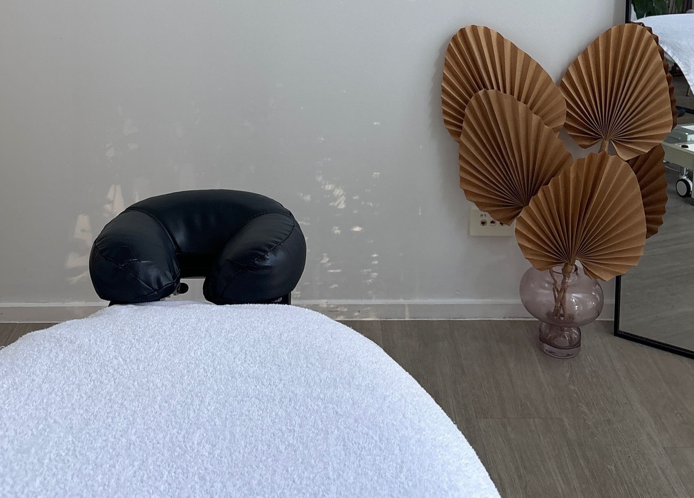Serene massage room at Nxt Level Integrated Health Pty Ltd in Bundall, Queensland, AU, featuring decor and treatment bed.
