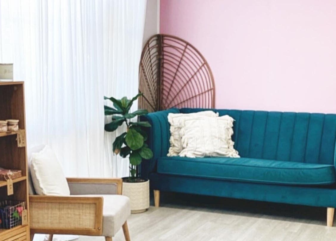 Chic lounge with teal sofa at Nxt Level Integrated Health Pty Ltd, Bundall, Queensland, AU.