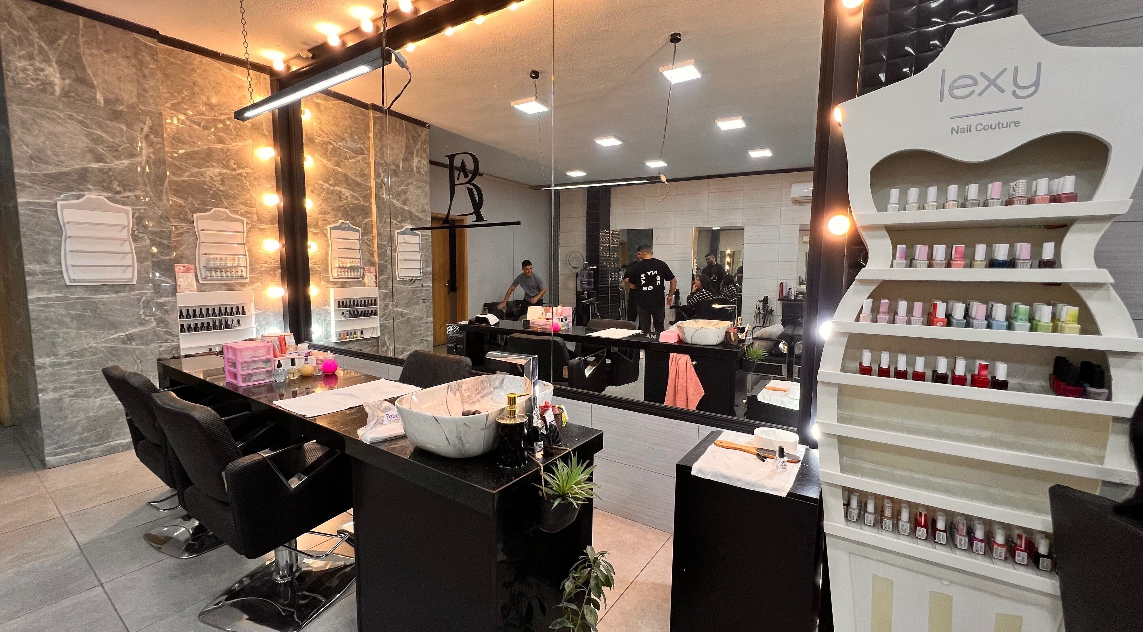Elegant nail studio at Nisreenailss in Jabal Lubnan, Jabal Lubnan, LB with modern decor and nail polish display.