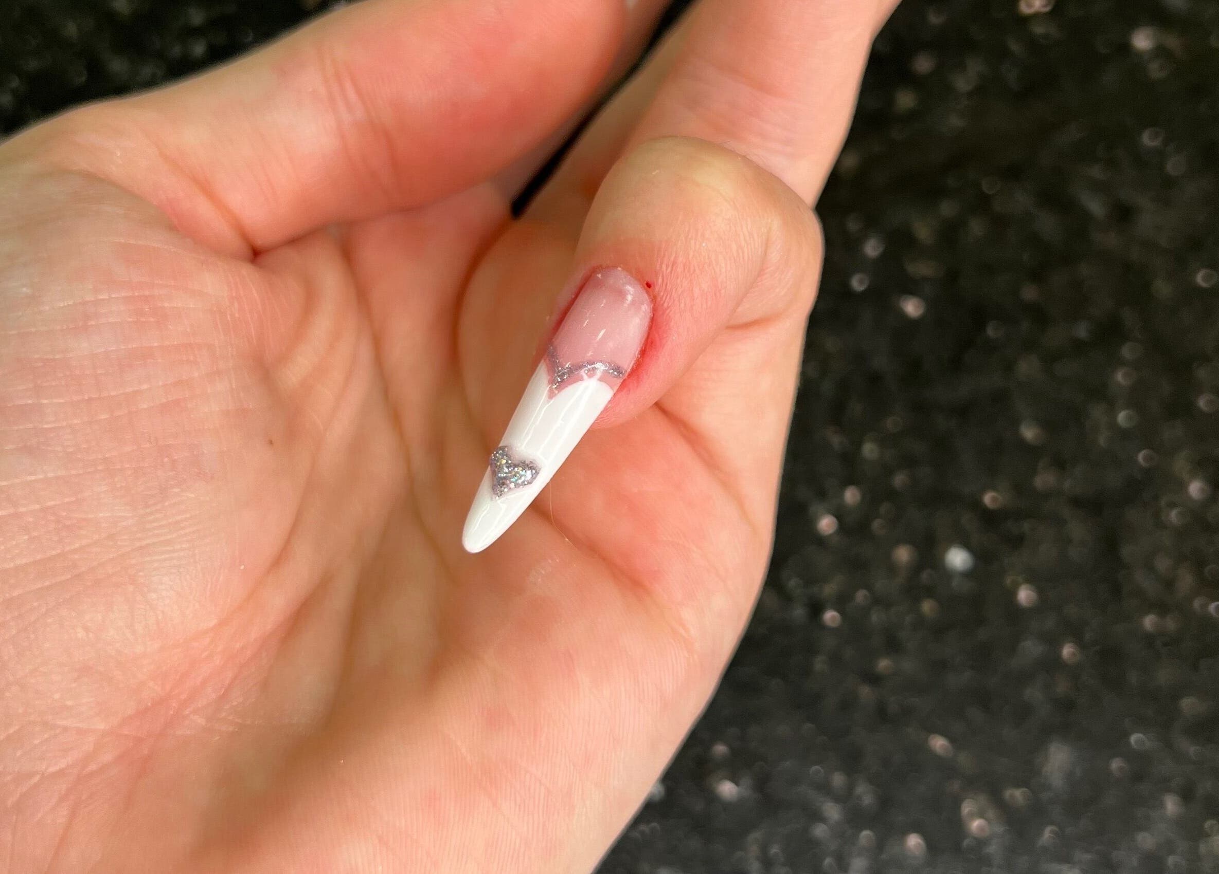 Stylish white nail art with silver accents at Nisreenailss, Jabal Lubnan, Jabal Lubnan, LB.