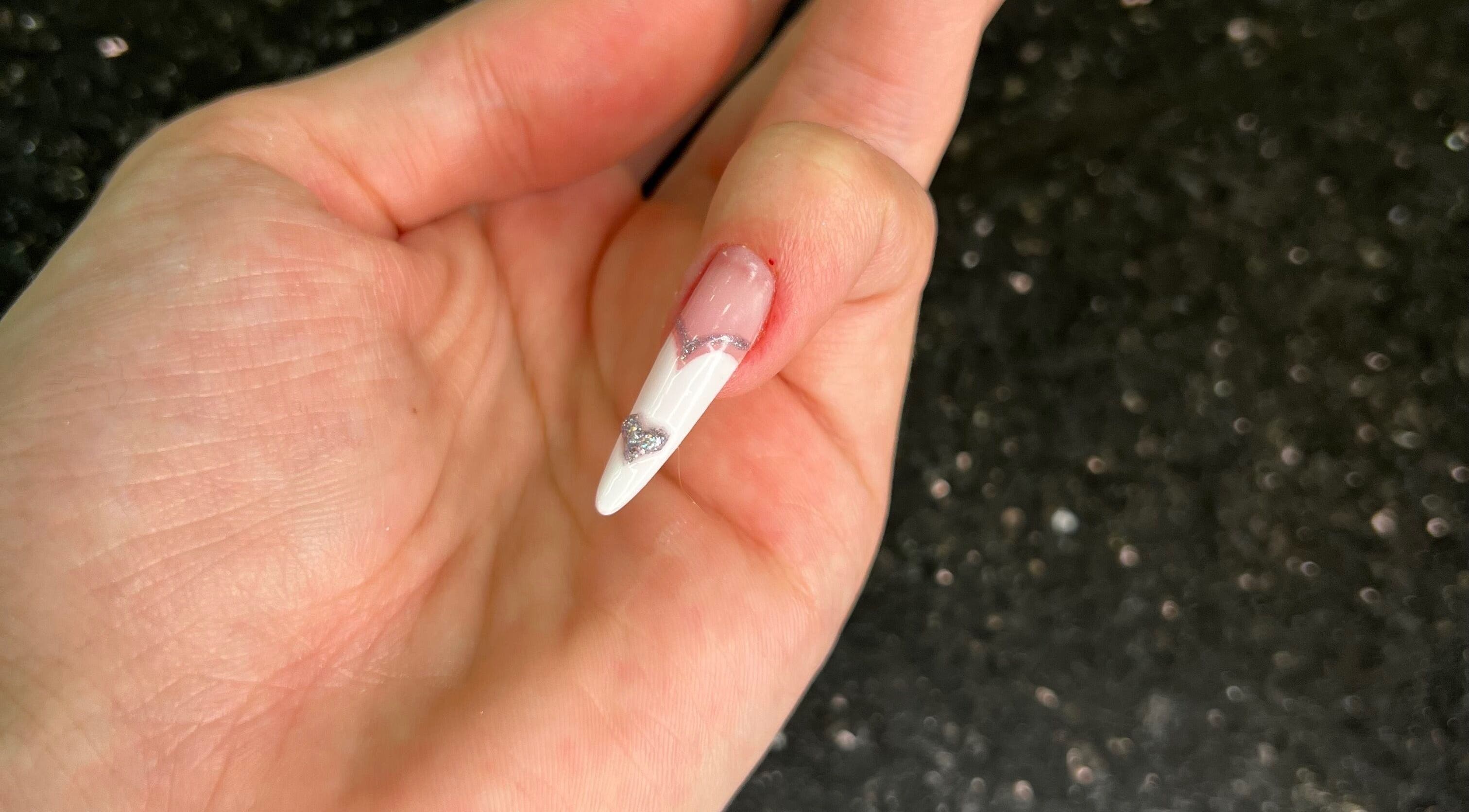 Stylish white nail art with silver accents at Nisreenailss, Jabal Lubnan, Jabal Lubnan, LB.