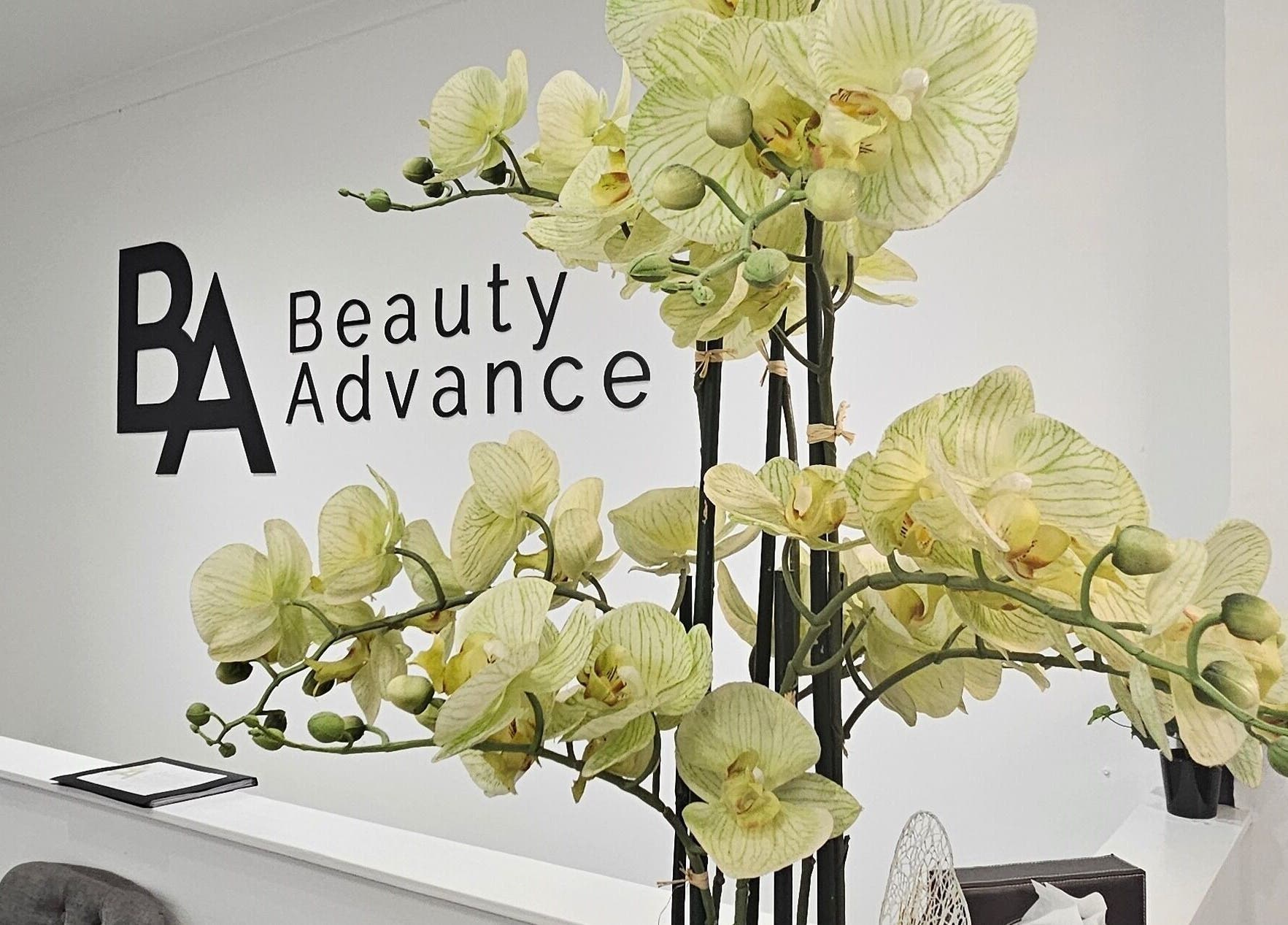 Elegant orchids at Beauty Advance Skin & Laser Clinic reception, Cardiff, Wales, GB.