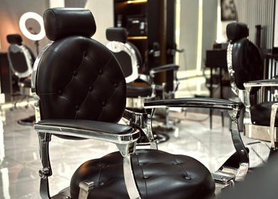 Luxurious barber chairs at Royal Shave Barber in Dubai, AE, offering premium grooming services.