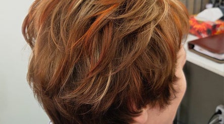 Stylish short hairstyle with highlights at Salon@735 in Pretoria, Gauteng, ZA.
